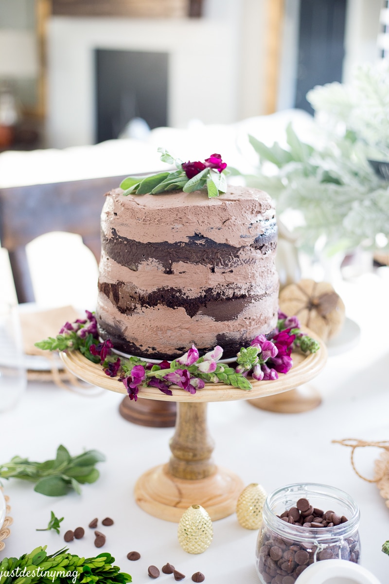 Naked Chocolate Cake on a wood cake stand
