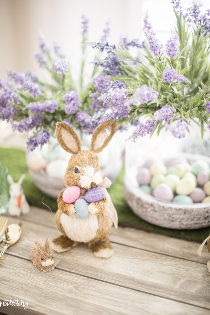 Easter bunny in front of faux egg centerpiece 