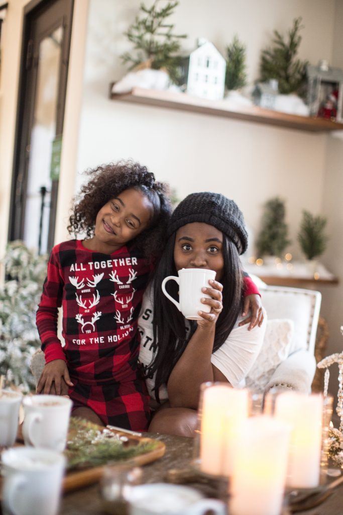 Mother and daughter drinking hot cocoa 