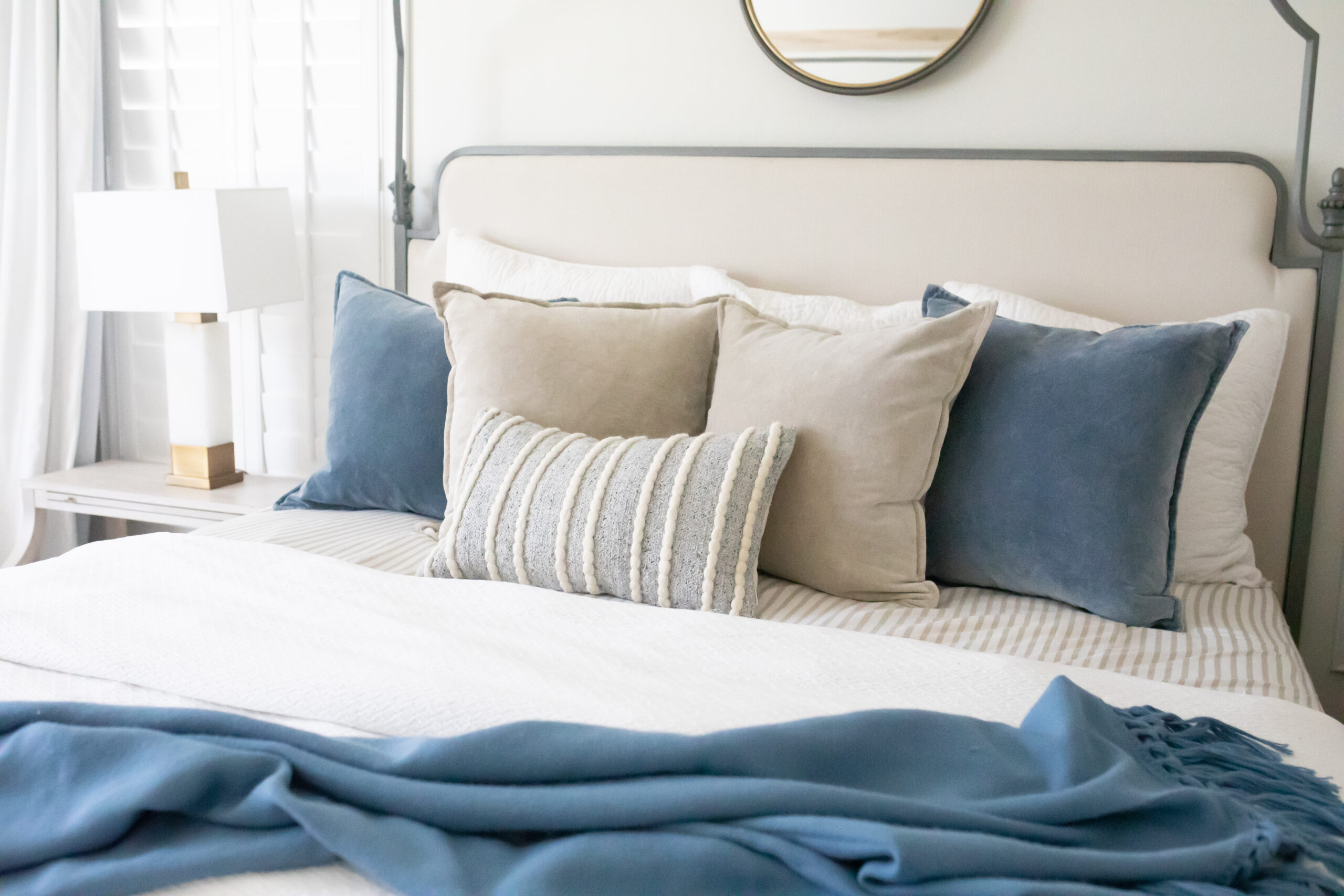 White bed with outlet colorful pillows