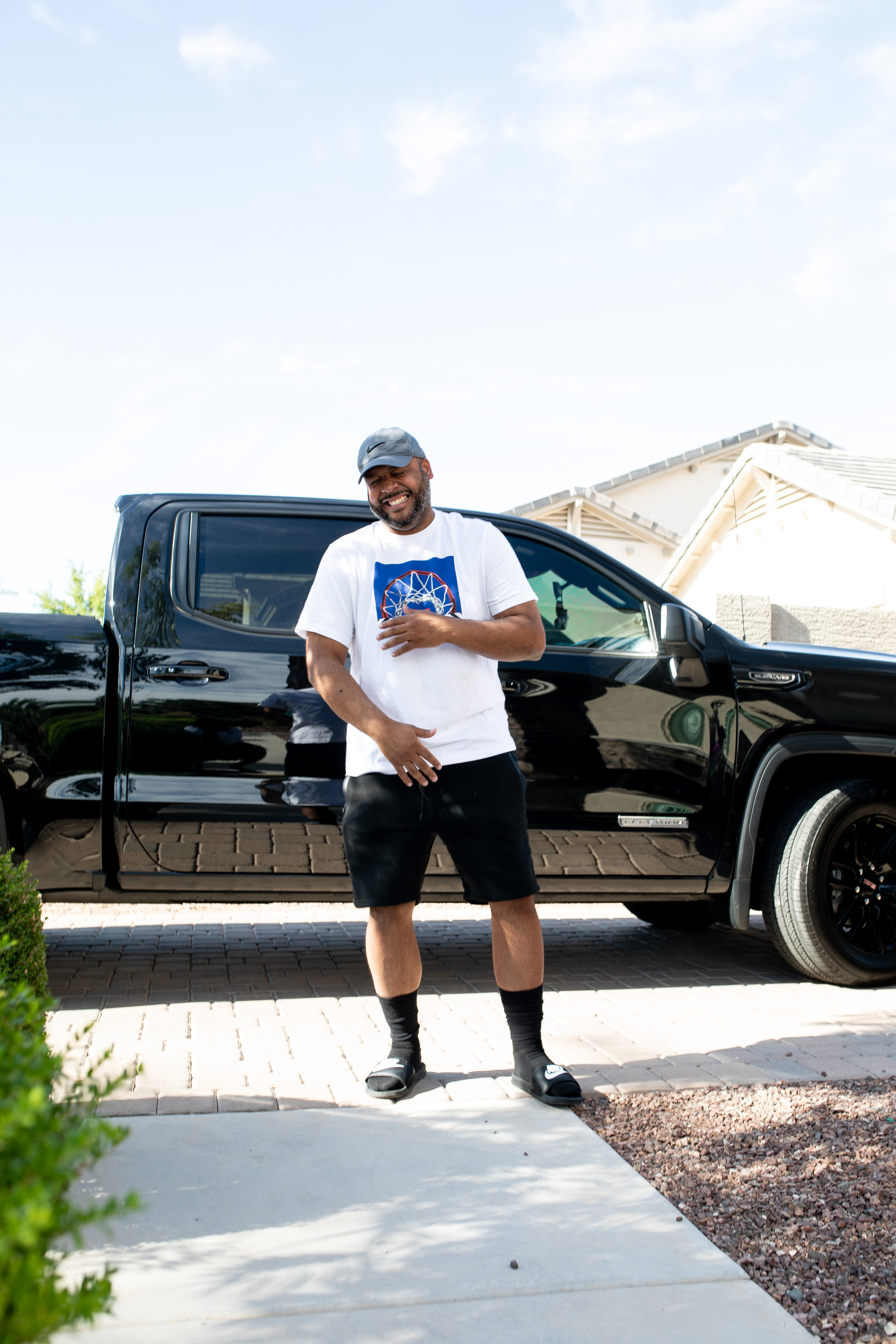 Laughing Dad in front of black truck 