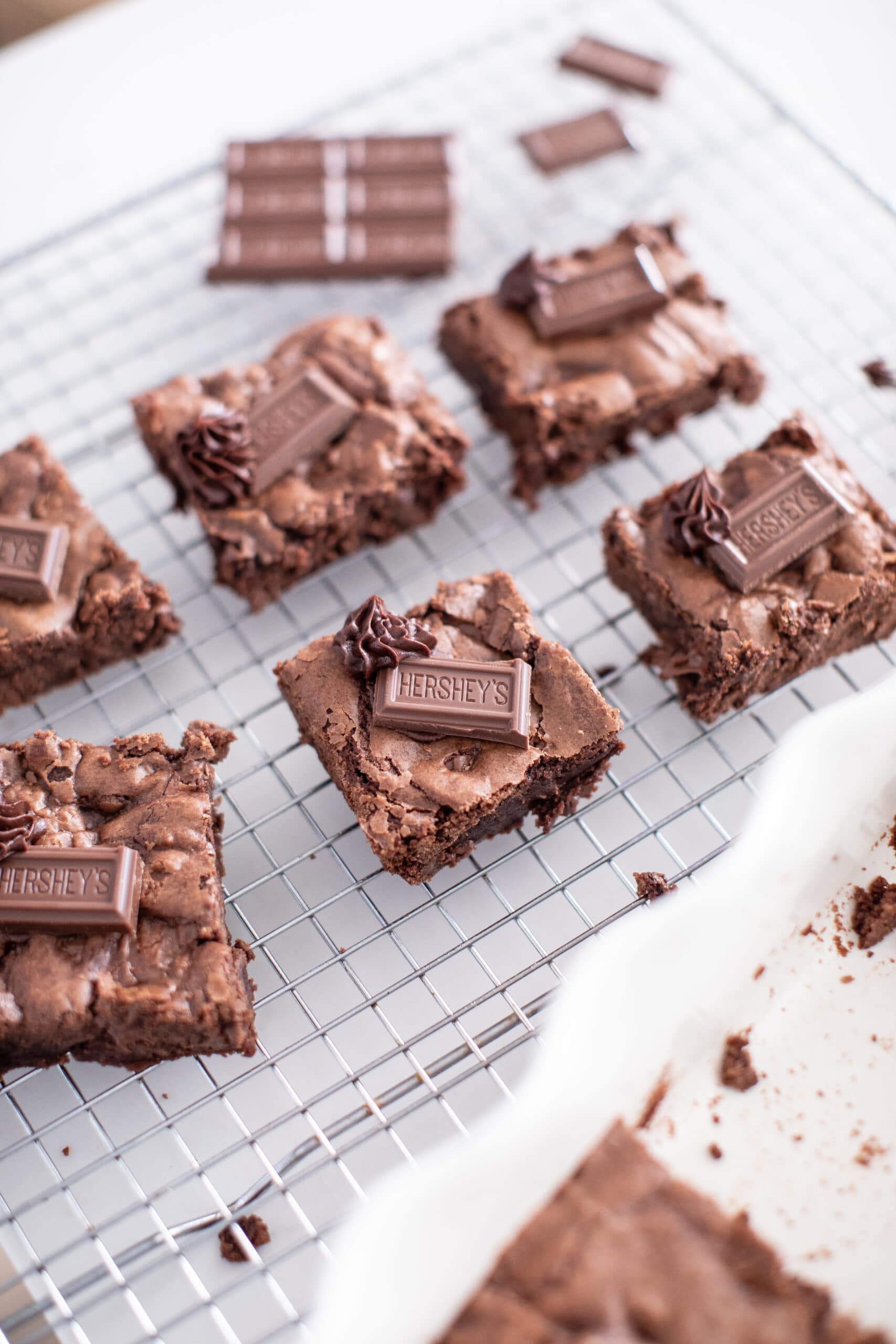 Attaching sticks to chocolate bars