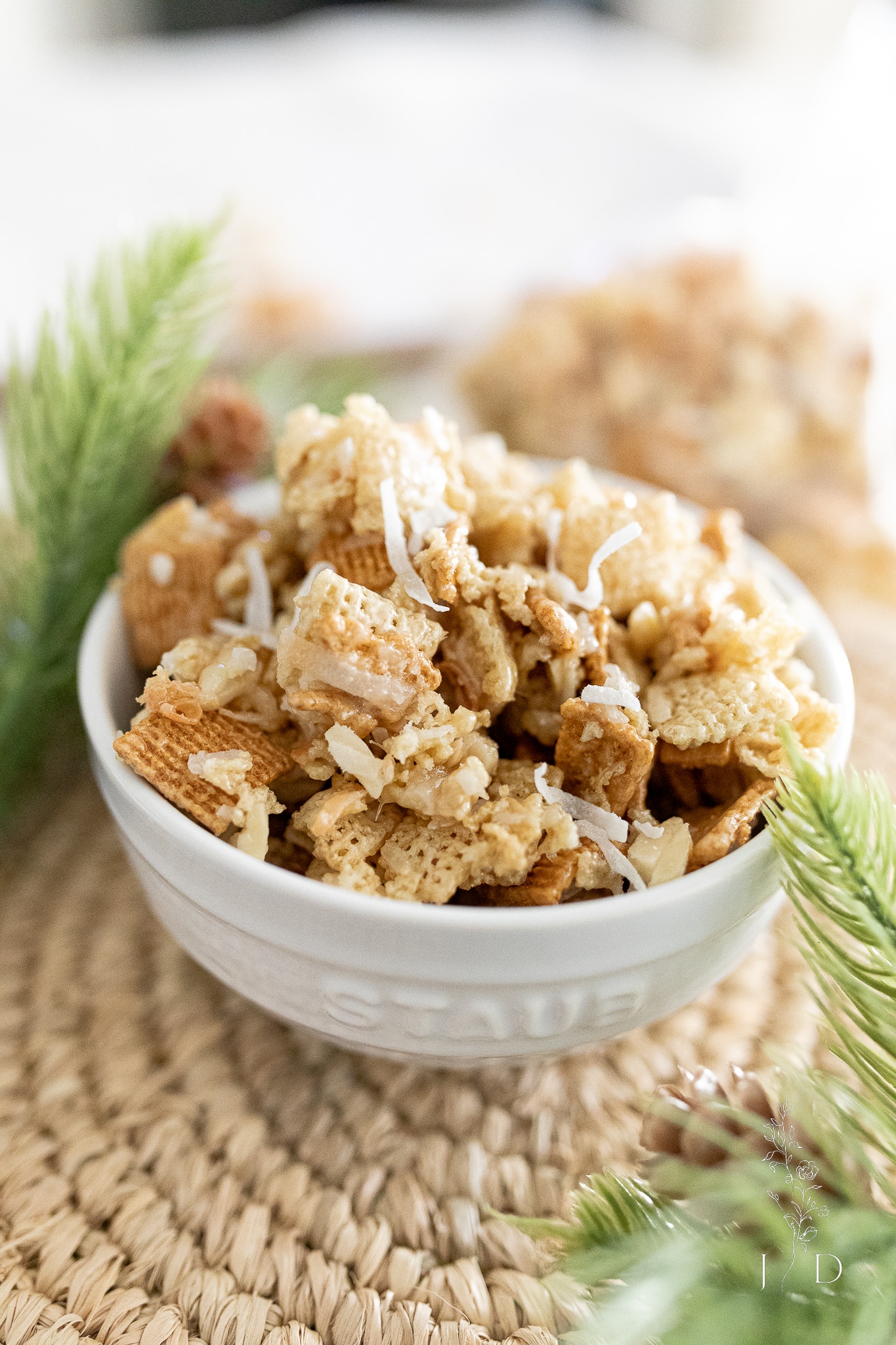 Coconut Chex mix in a white bowl