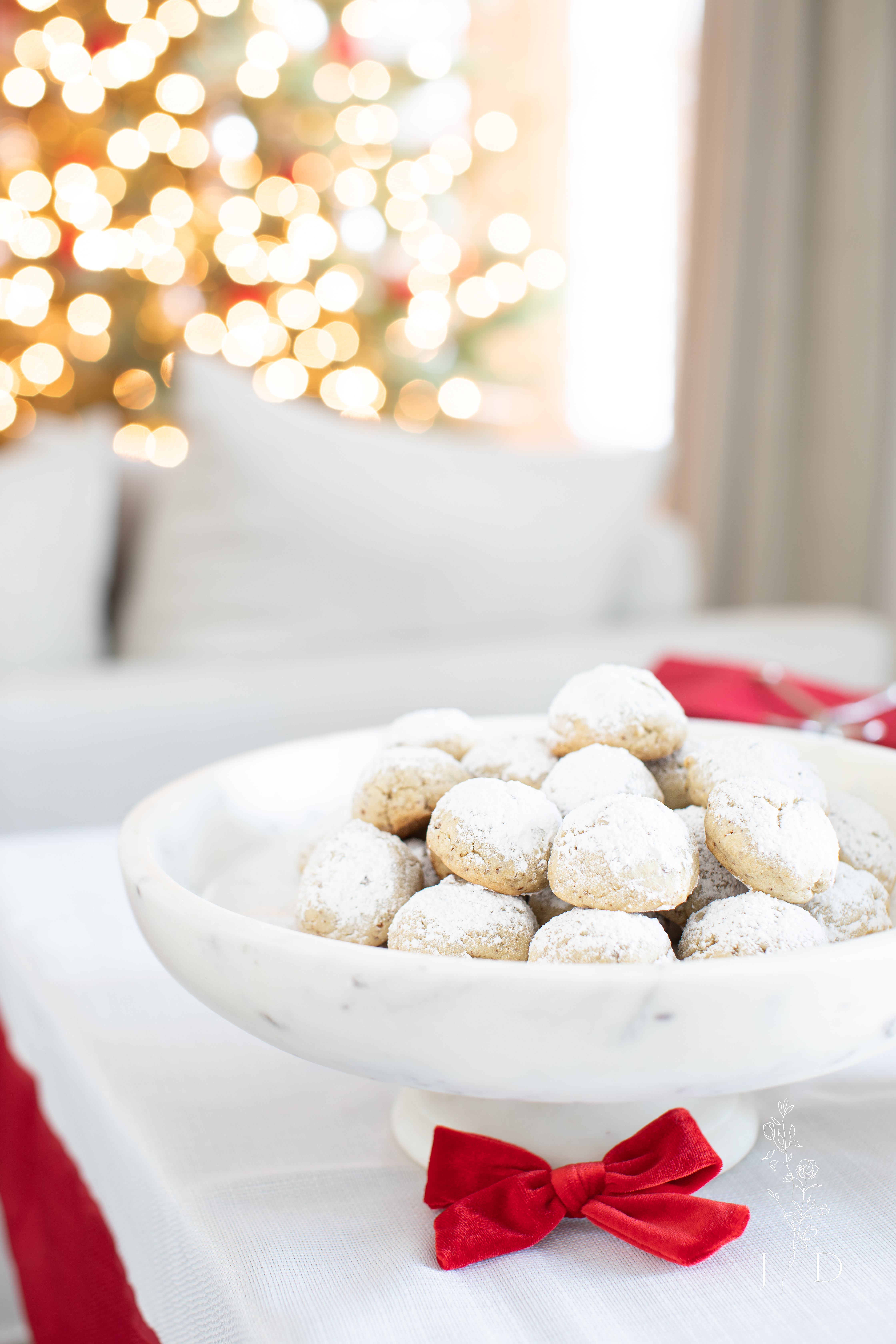 Tradtional Mexican Christmas Cookies on a marble tray with a pedestal.