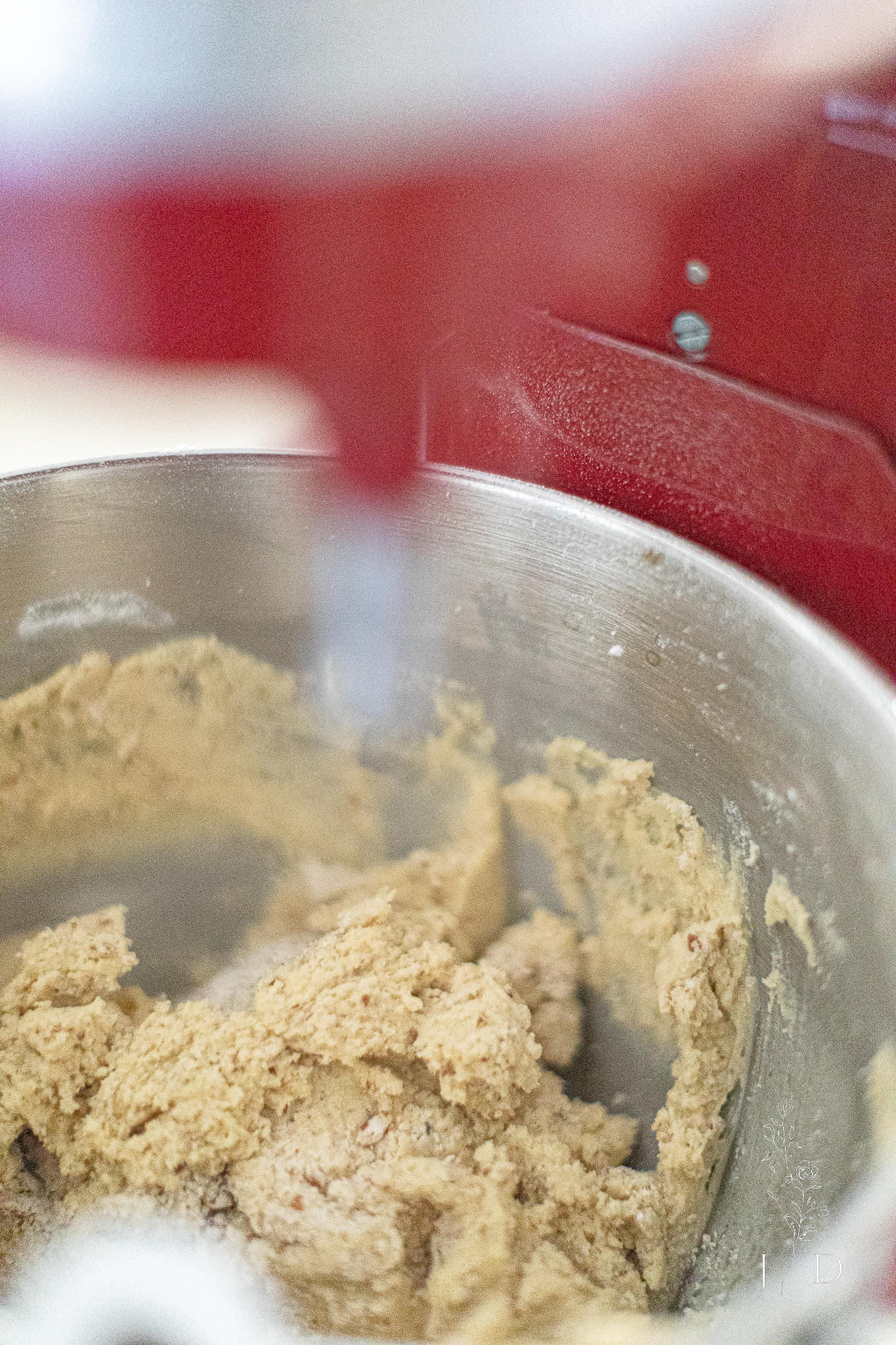 Mexican Christmas cookie dough with chopped pecans in it.