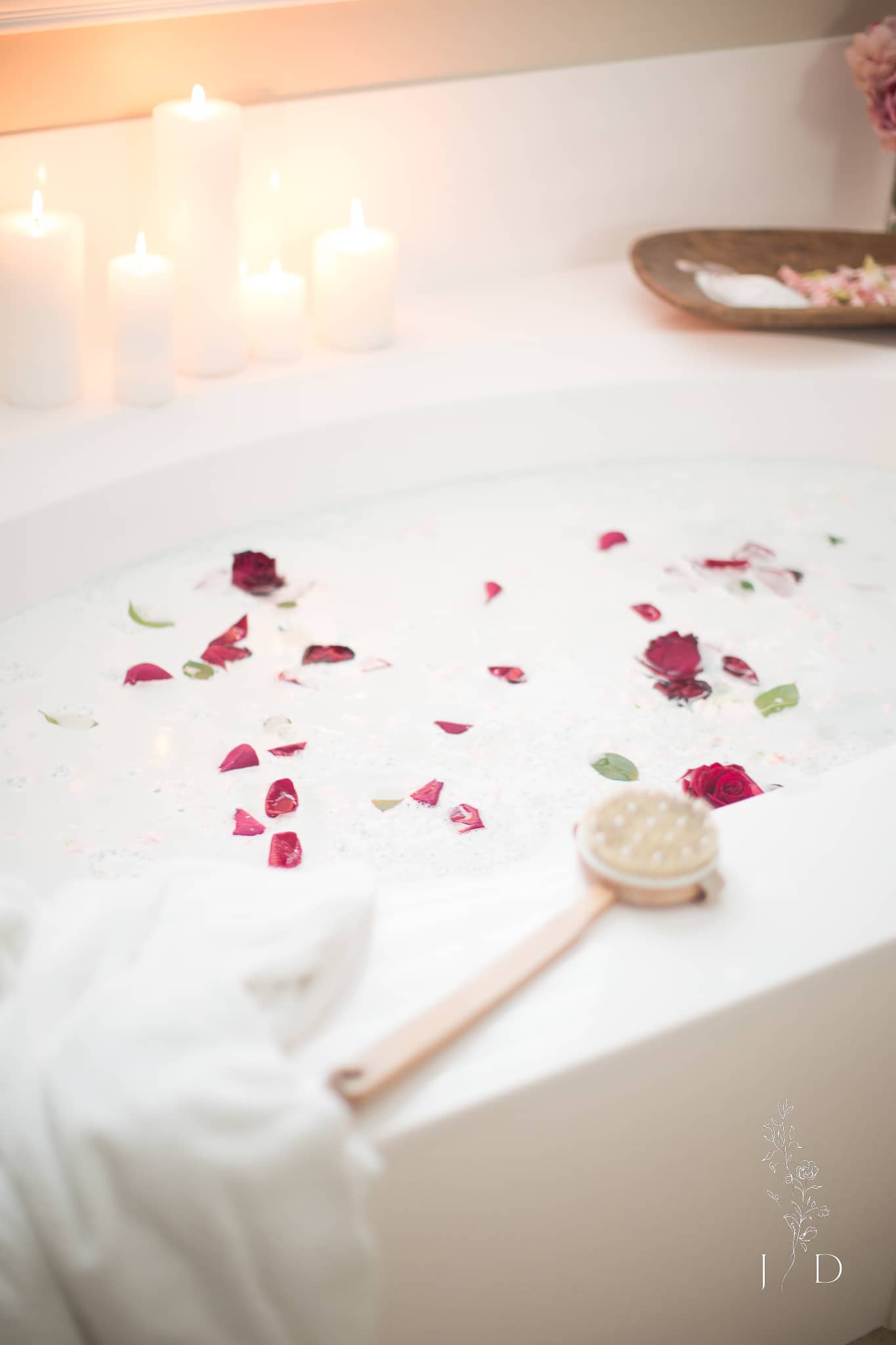 Beautiful bath with red rose petals 