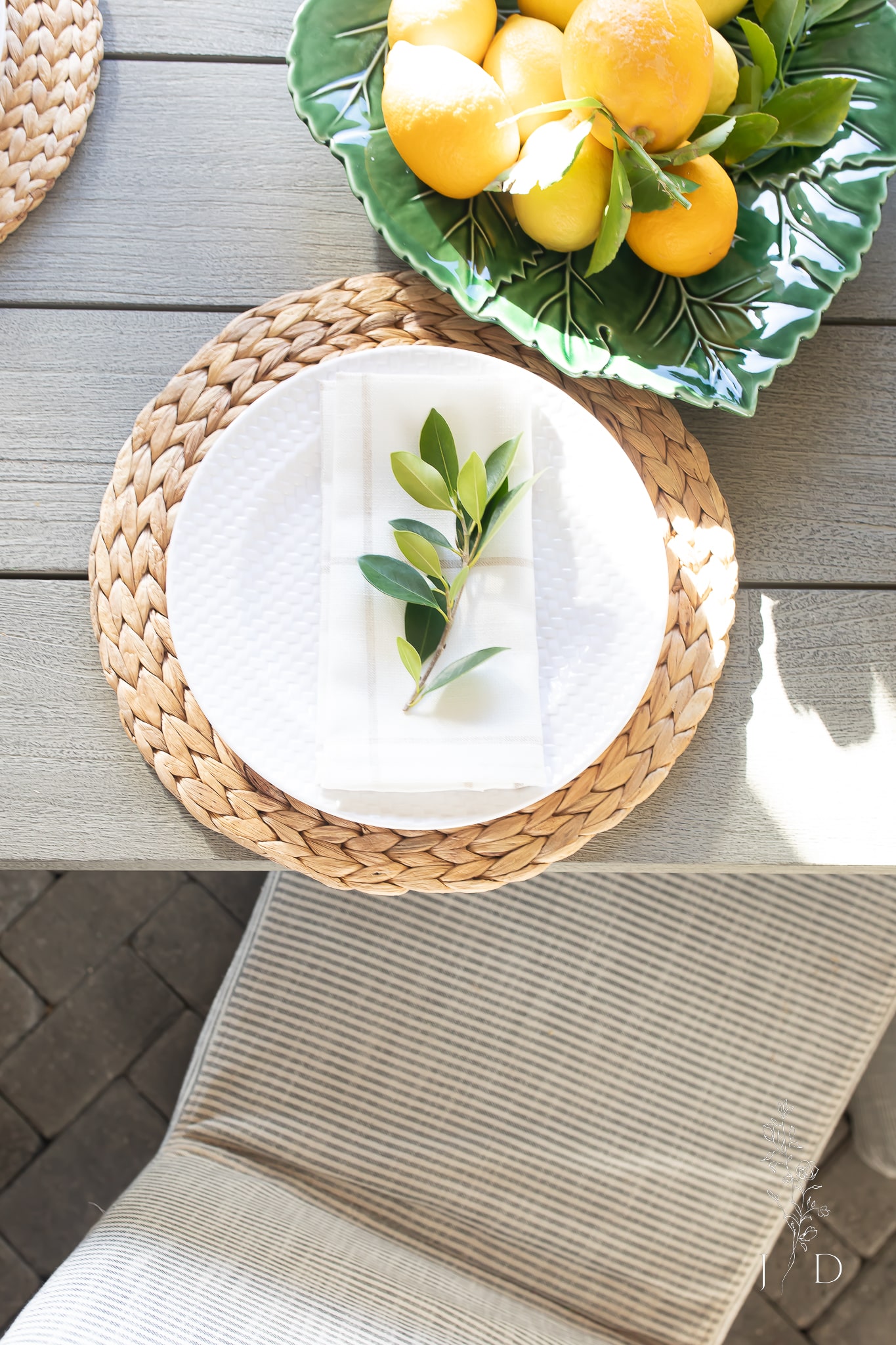 Outdoor table with layers of natural elements 