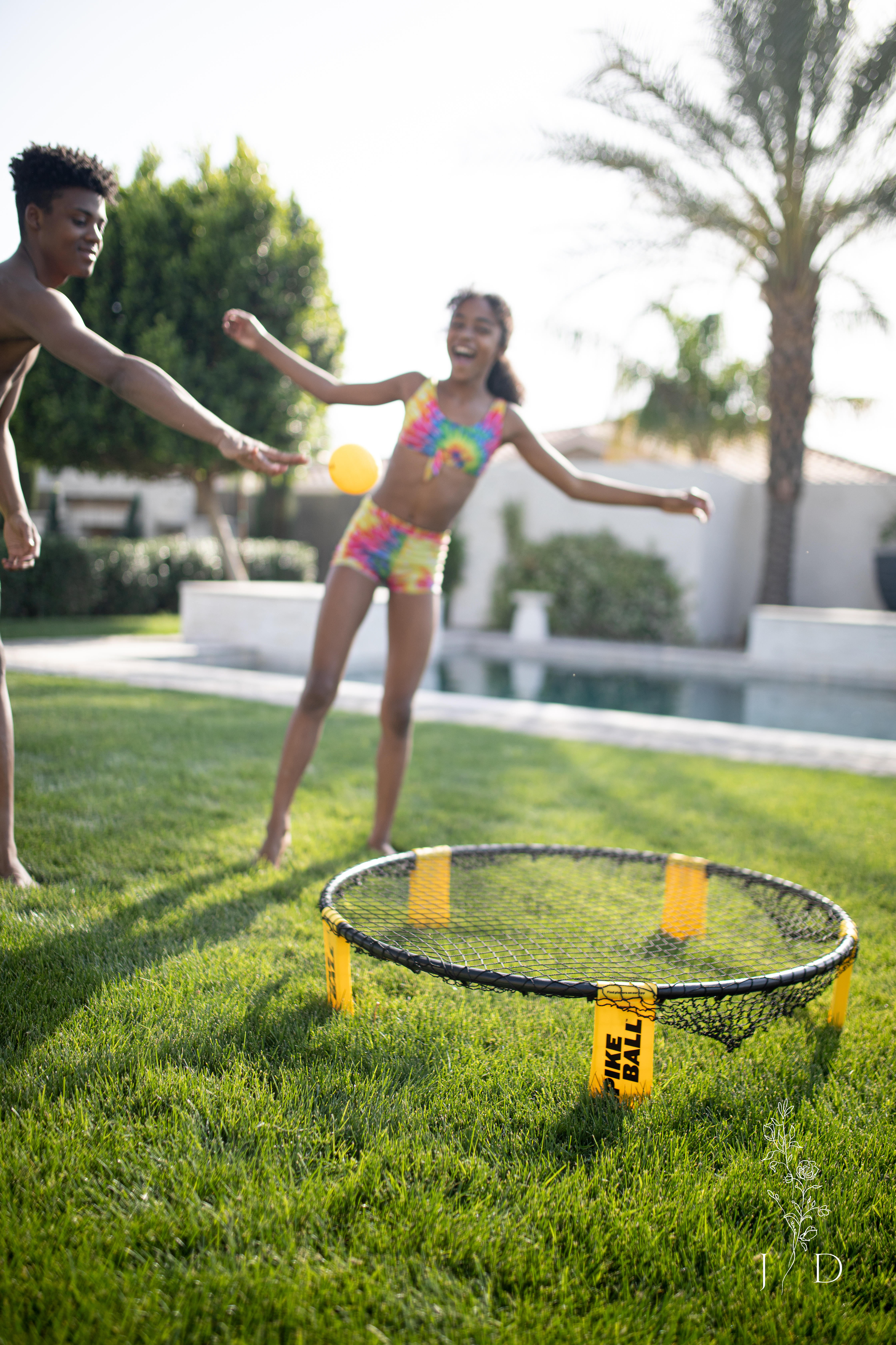 Spikeball being played in the backyard