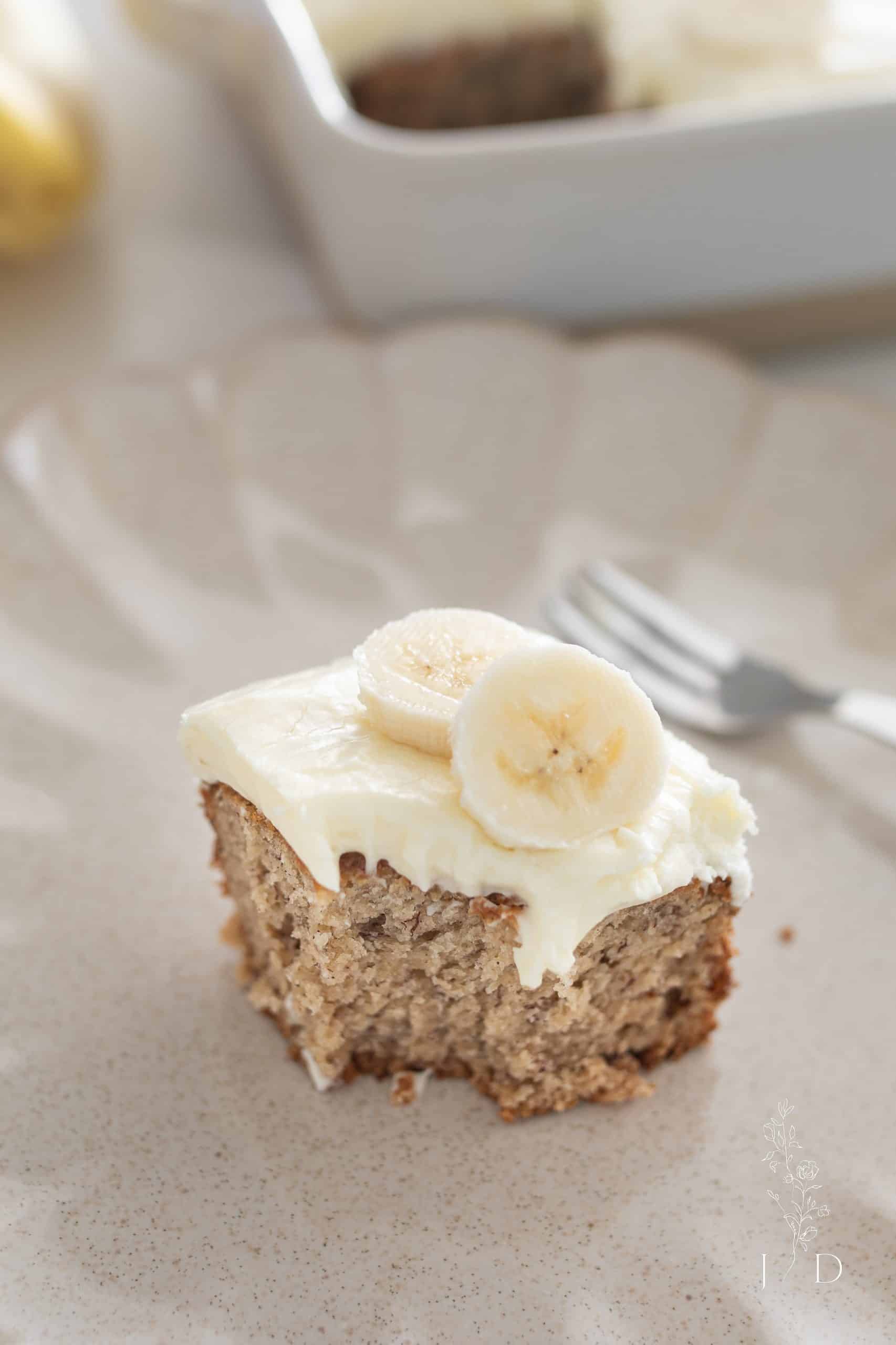 slice bananas on top of fresh homemade banana cake 