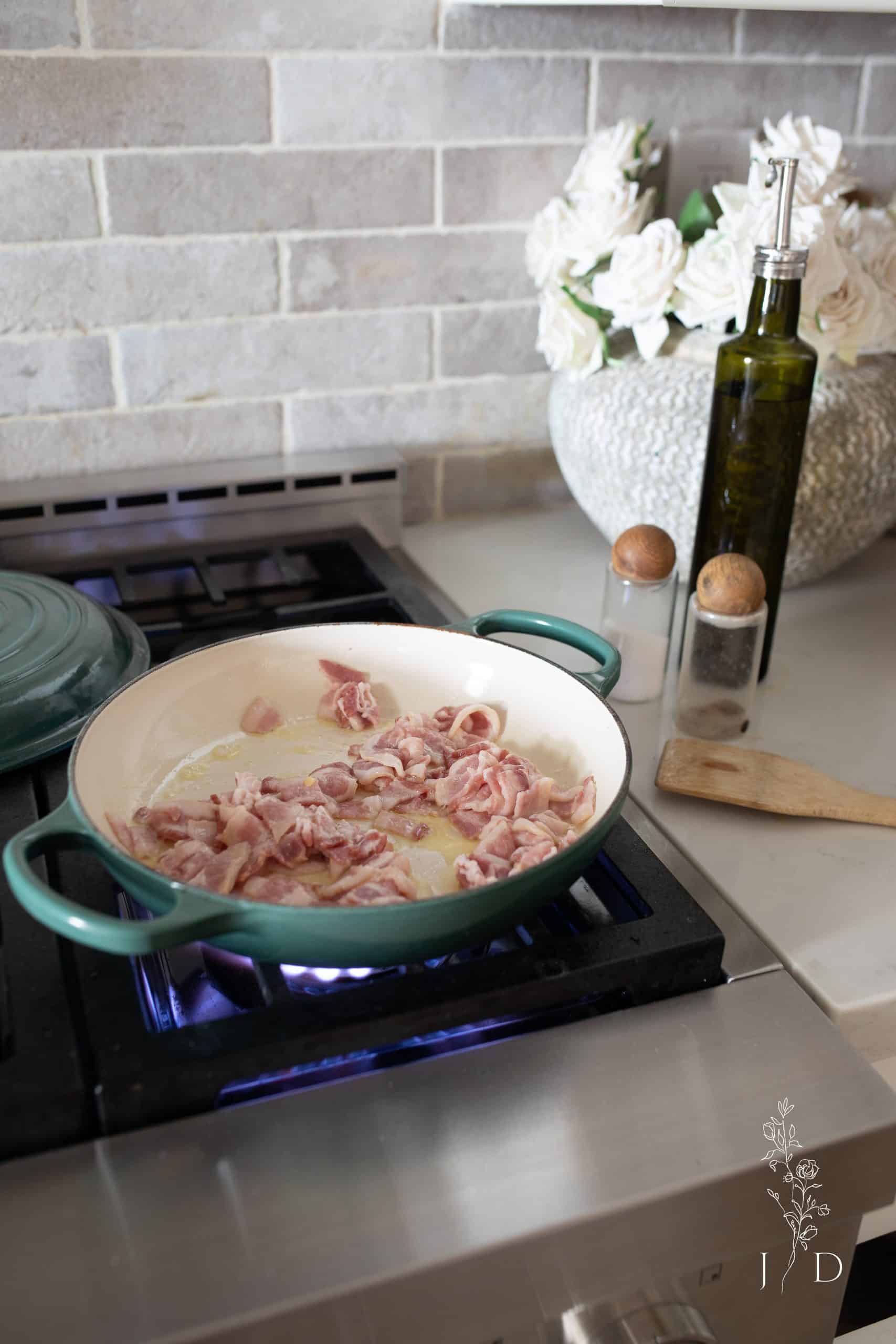 Bacon cooking in frying pan 