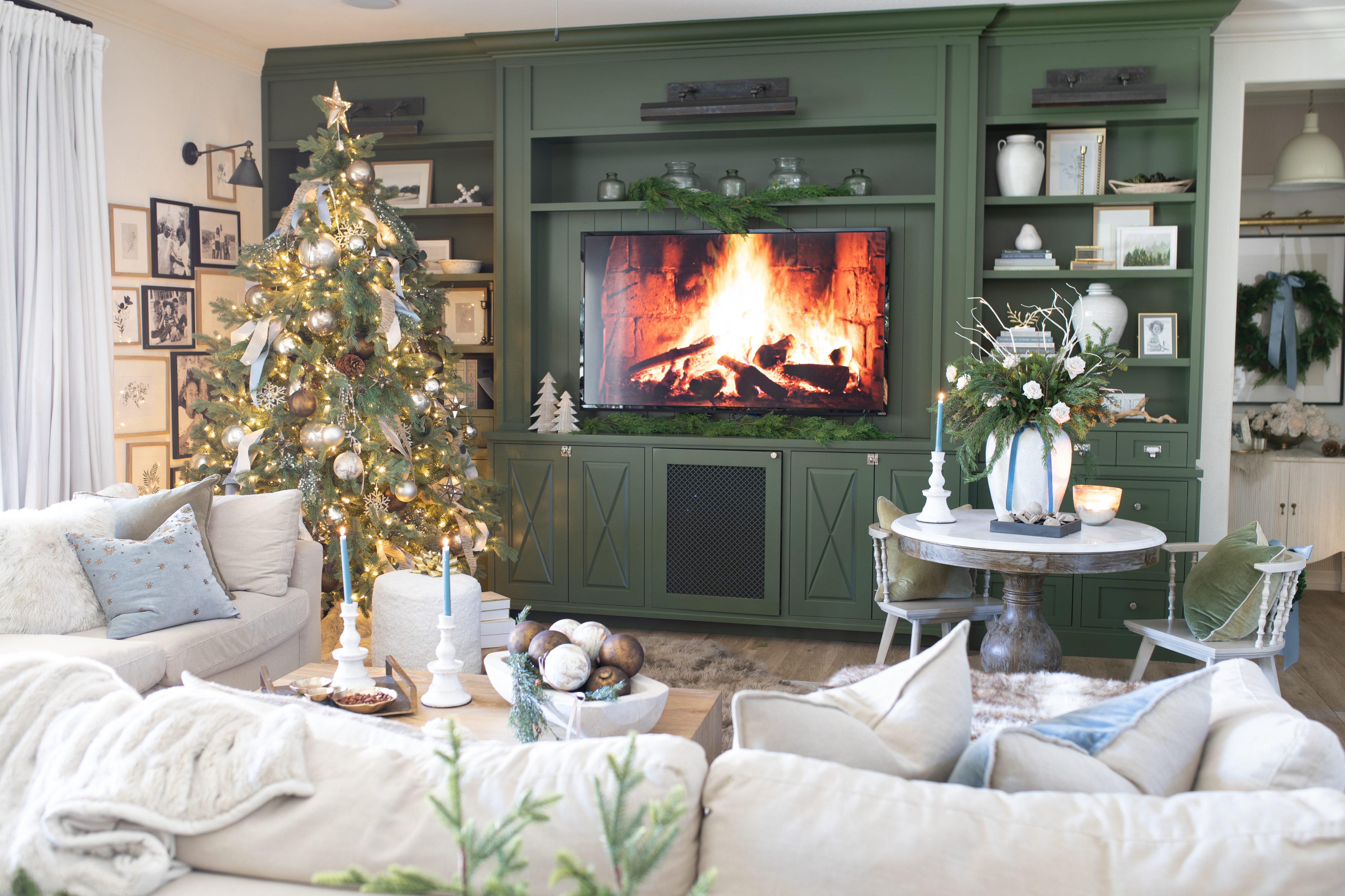 Family Room Decorated for Christmas with a tree in the corner 